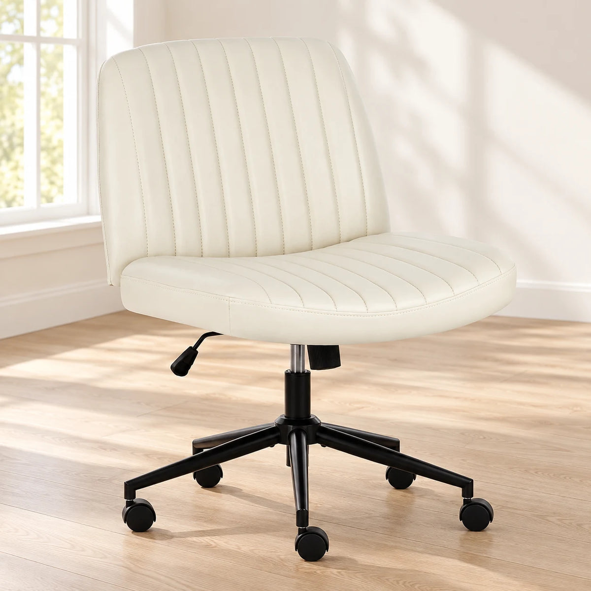 Beige PU armless desk chair beside a desk in a bright room
